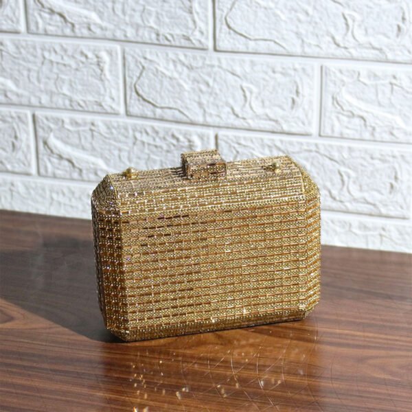 Vaska gold party clutch bag with a shoulder strap