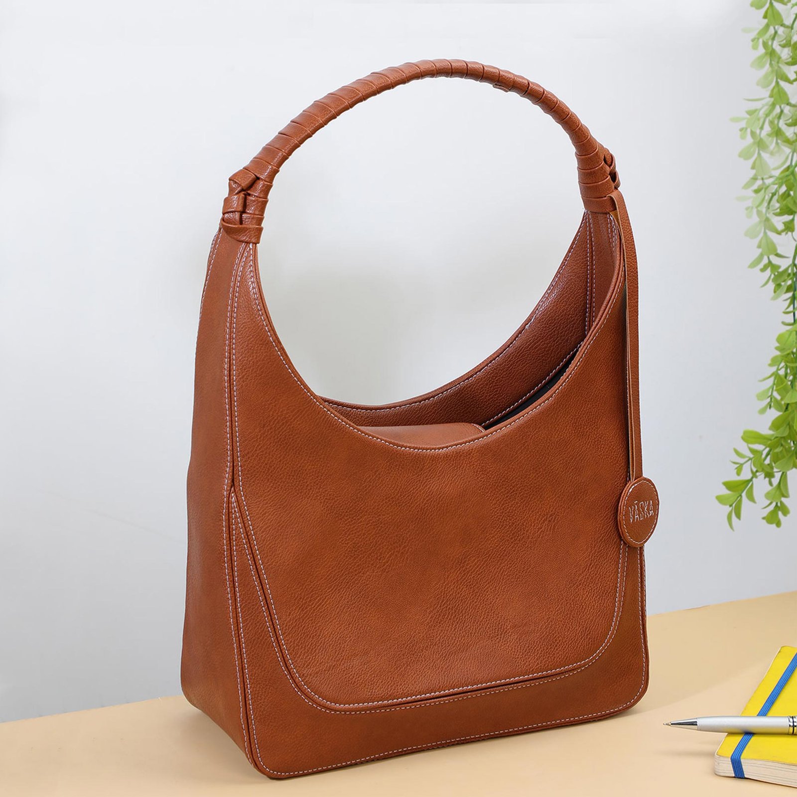 Vaska tan designer handheld handbag